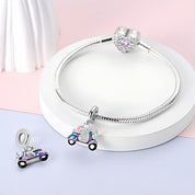 Robogó charm – ezüstözött